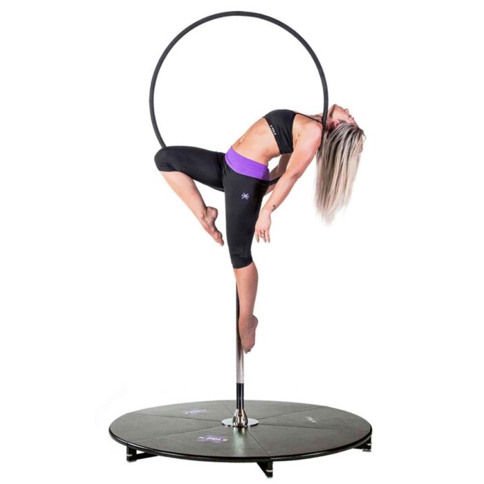 A woman on an X Pole LyraPole