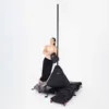 A male pole dancer on his Lupit freestanding portable stage base platform dance pole